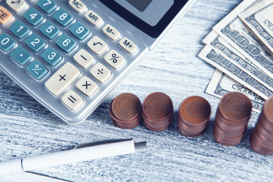 services-01 a-calculator-pen-and-money-on-a-table-x4vwfpzy-2o